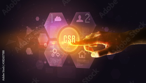 Hand touching CSR inscription, new technology concept © ra2 studio