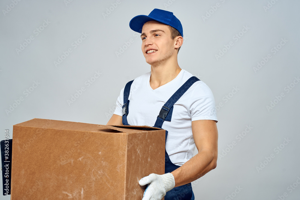 Man worker with box in hands delivery loading service packing service Man worker with box in hands delivery loading service packing service