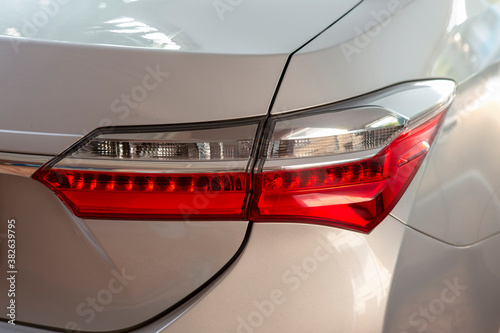 Modern sedan tail lights come in two red and white colors in the same lamp.