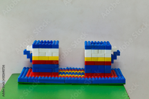 a building structure made with building blocks by a six year old kid without any reference picture showing his creative and architecural skills photo