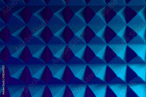 Abstract pyramid background in colored light.