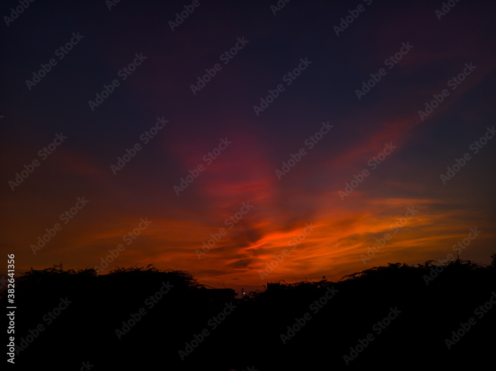 sunset with burning edges of the clouds