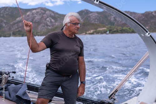 A man sailing a boat in the Mediterranean Sea
