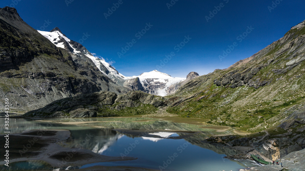 Europe top 10 best hiking trails with glacier and alpine lake with crystal clear blue lake and sky