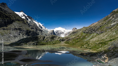 Europe top 10 best hiking trails with glacier and alpine lake with crystal clear blue lake and sky