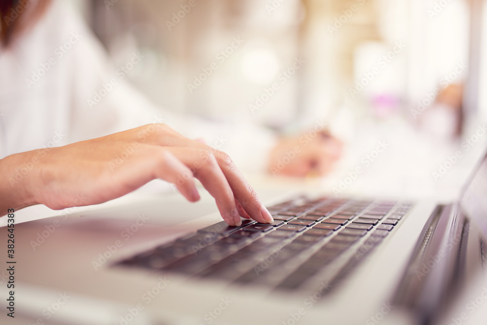Business hand working on laptop,Blurred background,, finances, and economy concept through a laptop. Business hand working on laptop,Blurred background,, finances, and economy concept through a laptop.