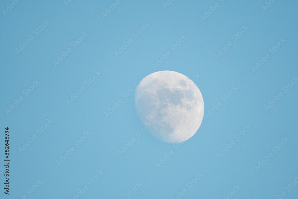 The moon in the blue sky The moon in the blue sky