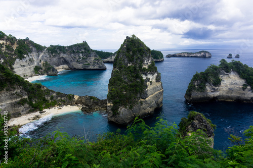 Atuh beach is a famous beach in nusa penida, bali. hard to get there,some called it as hidden beach, Rustic, isolated cove beneath a sheer cliff face, with a sandy beach & offshore rock formations.