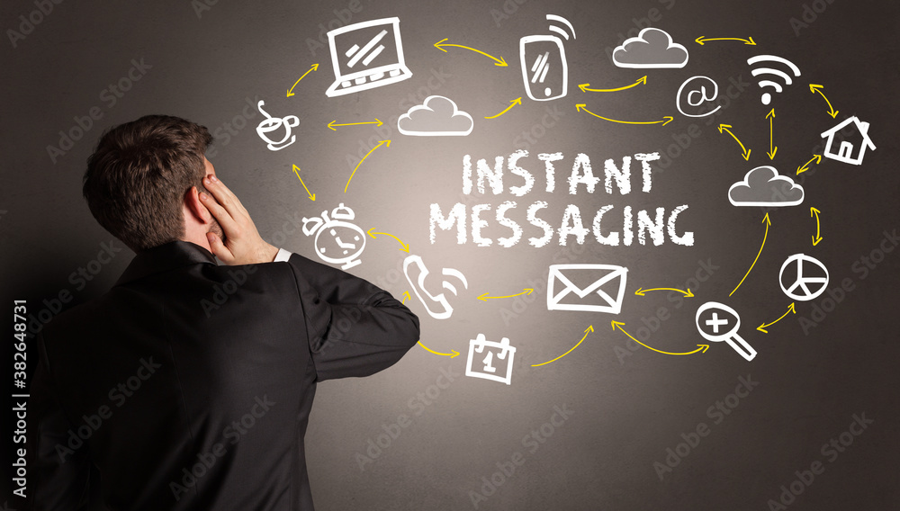 businessman drawing social media icons with INSTANT MESSAGING inscription, new media concept businessman drawing social media icons with INSTANT MESSAGING inscription, new media concept