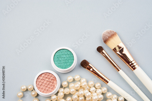 eyeshadow accessories makeup brushes merchandise collection professional cosmetics on gray background