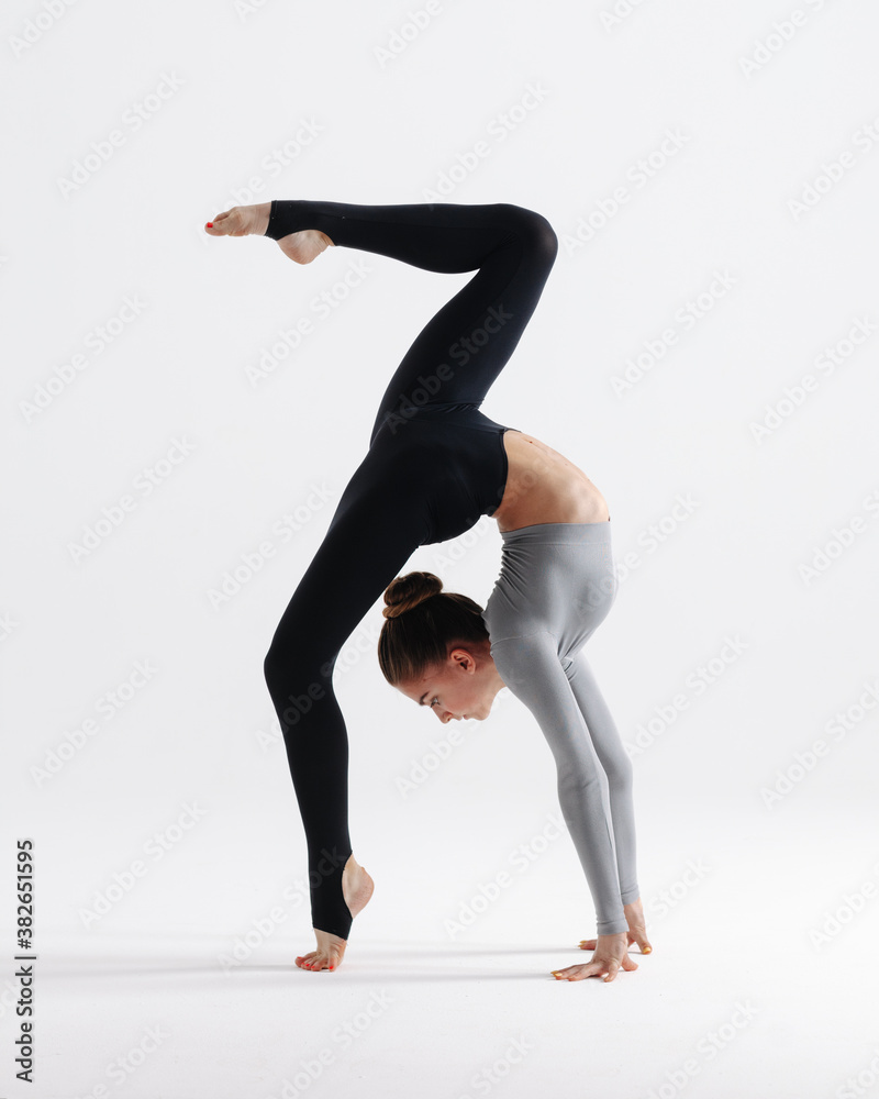 Young gymnast girl stretching and training Young gymnast girl stretching and training