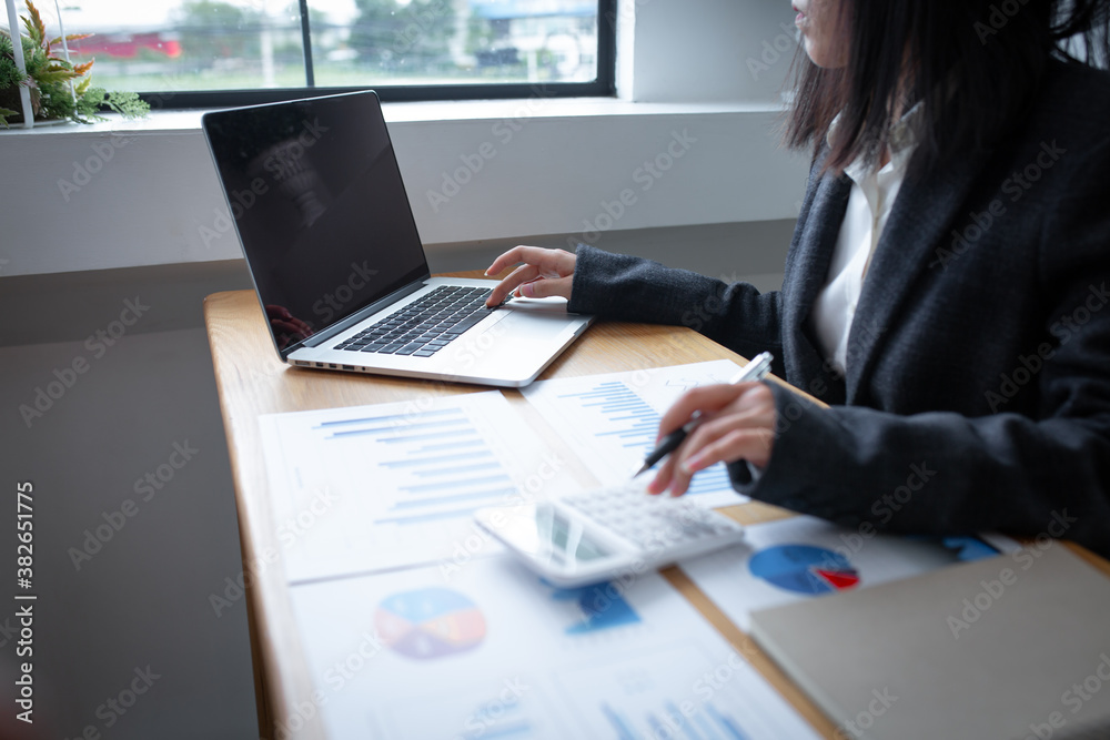 Financial Businesswomen analyze the graph of the company's performance to create profits and growth, Market research reports and income statistics, Financial and Accounting concept. Financial Businesswomen analyze the graph of the company's performance to create profits and growth, Market research reports and income statistics, Financial and Accounting concept.