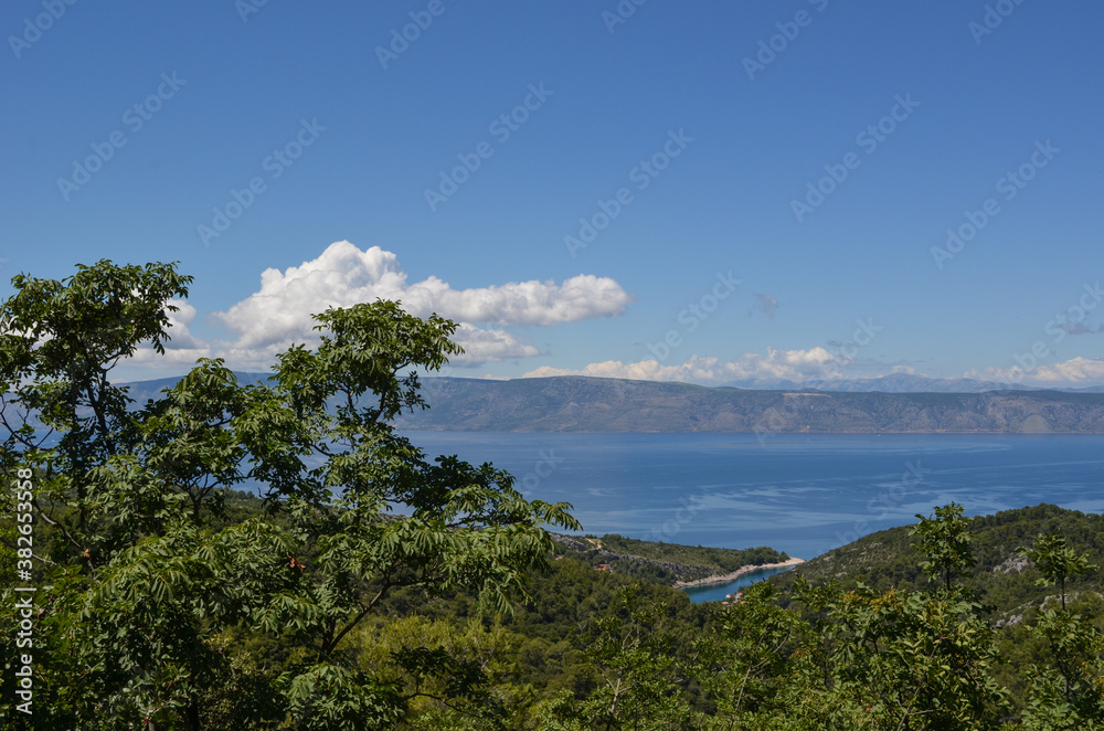 Landscape in Hvar Croatia with greenery, sea, hills and clouds