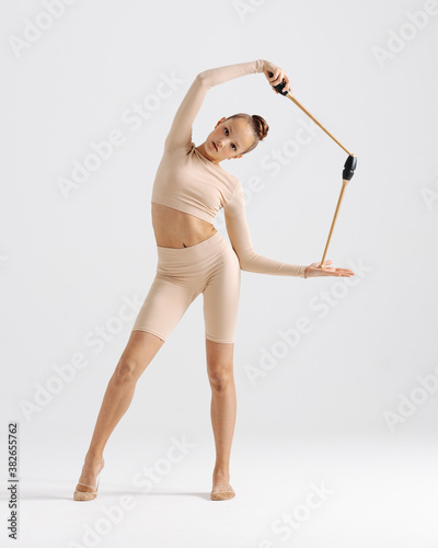 Young gymnast girl stretching and training