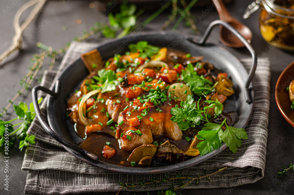 Pork steak with mushrooms and herbs