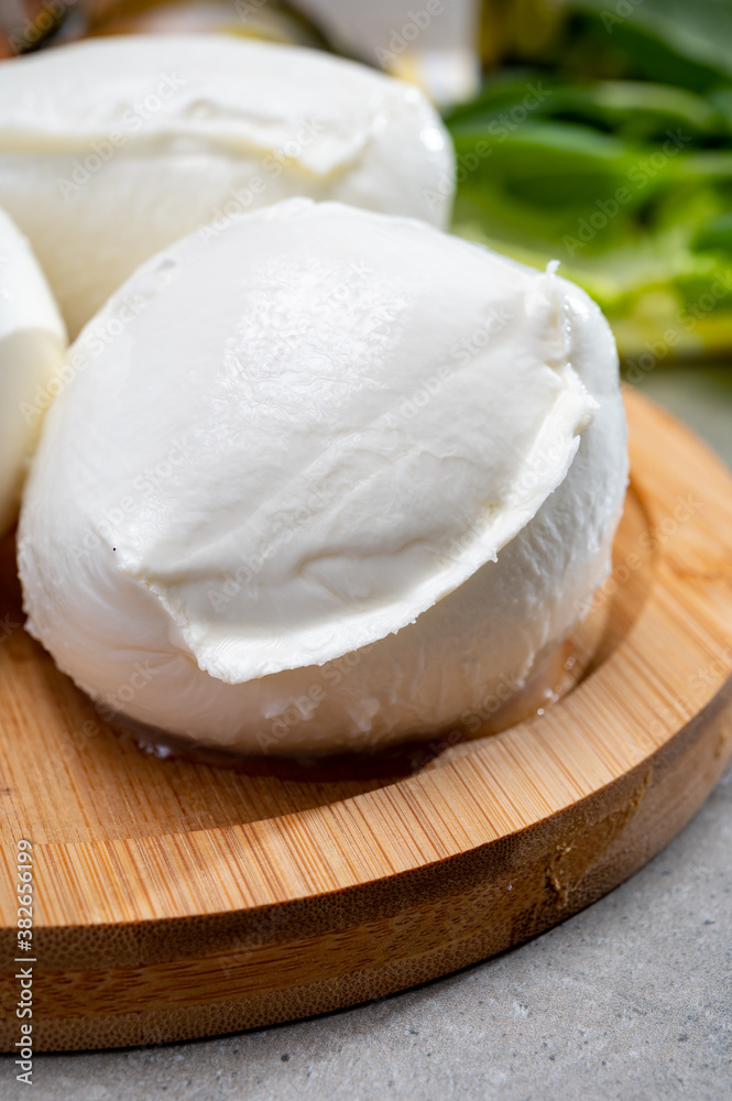 Fresh handmade soft Italian cheese from Campania, white balls of buffalo mozzarella cheese made from cow milk ready to eat