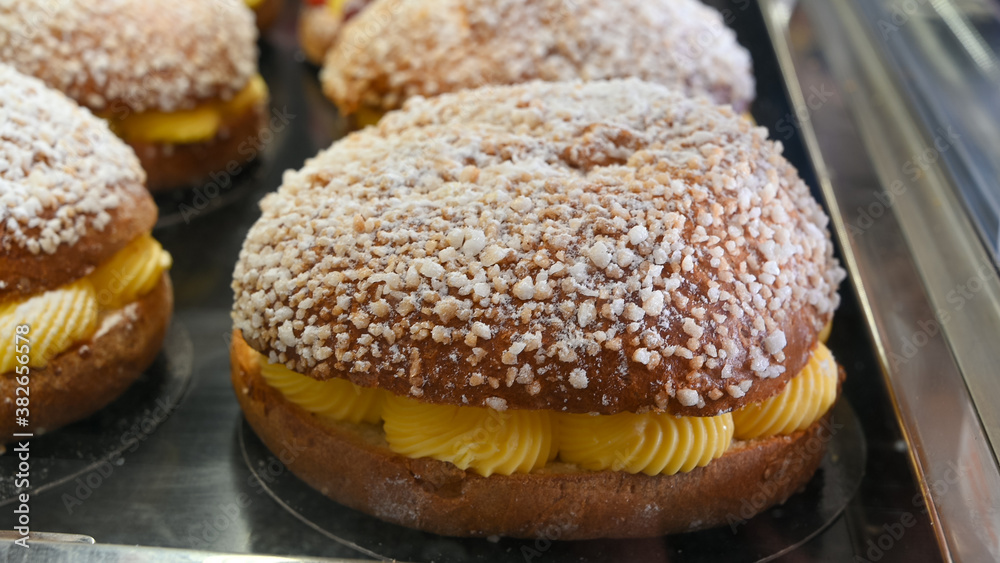 French fresh baked sweet filled brioche pastry tarte tropezienne in confectionery shop in Saint-Tropez, Provence, France French fresh baked sweet filled brioche pastry tarte tropezienne in confectionery shop in Saint-Tropez, Provence, France