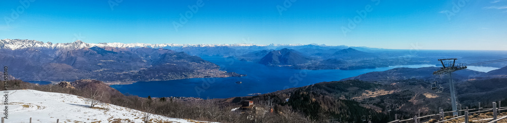 ultra wide aerial view of the Lake Maggiore and the Alps from Mottarone