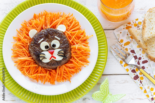 Fun Food for Kids - Lion shaped beef hamburger with carrots and cheese for a healthy lunch or dinner