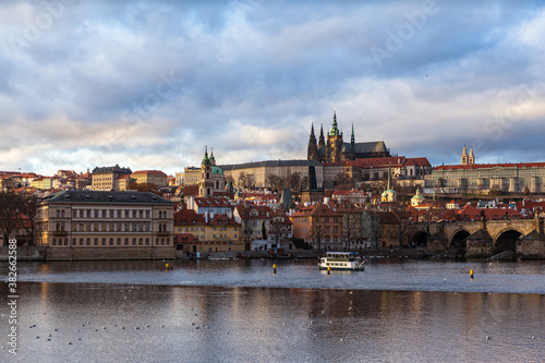 Panorama view of Prague Castle and St. Vitus Cathedral located in Mala Strana old district with Charles Bridge on the Vltava river side of Prague on winter day with blue sky cloud, Czech Republic