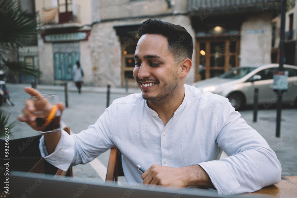 Happy smiling young man drink tea with lemon Happy smiling young man drink tea with lemon
