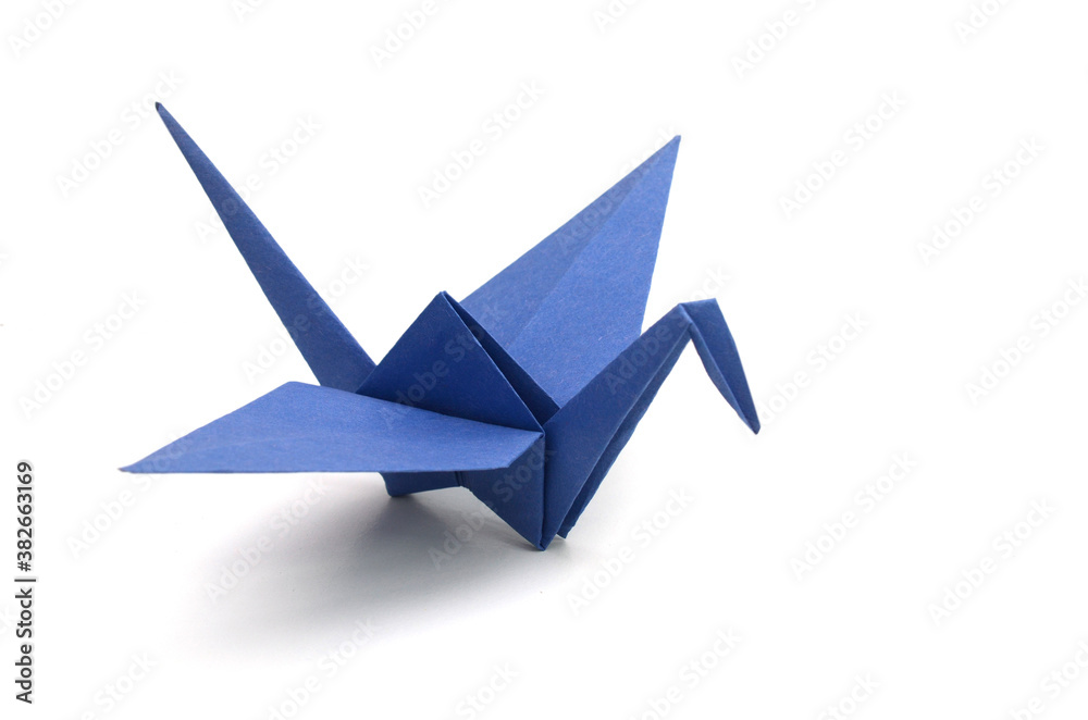 a blue origami bird paper on white a blue origami bird paper on white