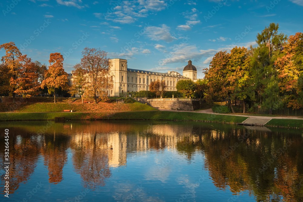 An ancient palace and park in the city of Gatchina. Landscape morning golden autumn.