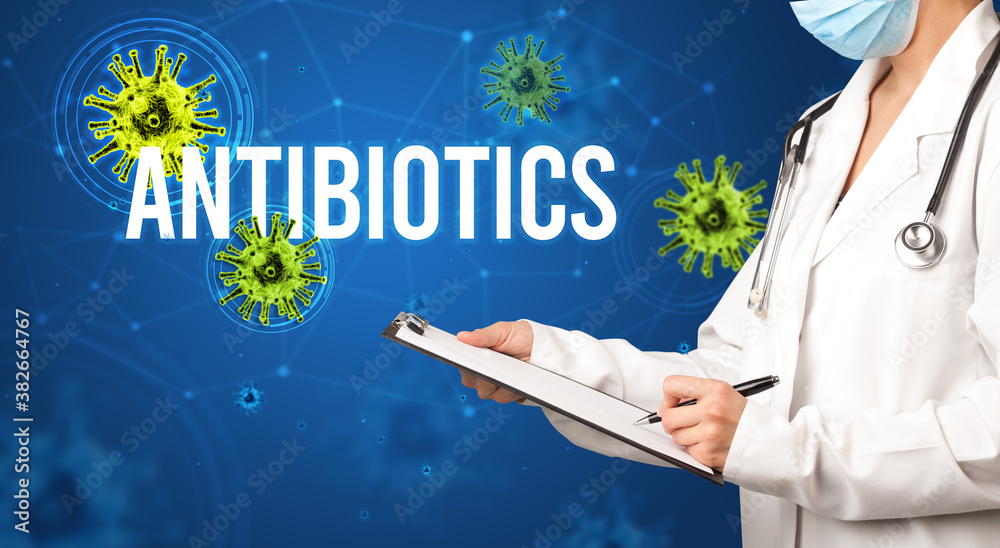 doctor prescribes a prescription with ANTIBIOTICS inscription, pandemic concept doctor prescribes a prescription with ANTIBIOTICS inscription, pandemic concept