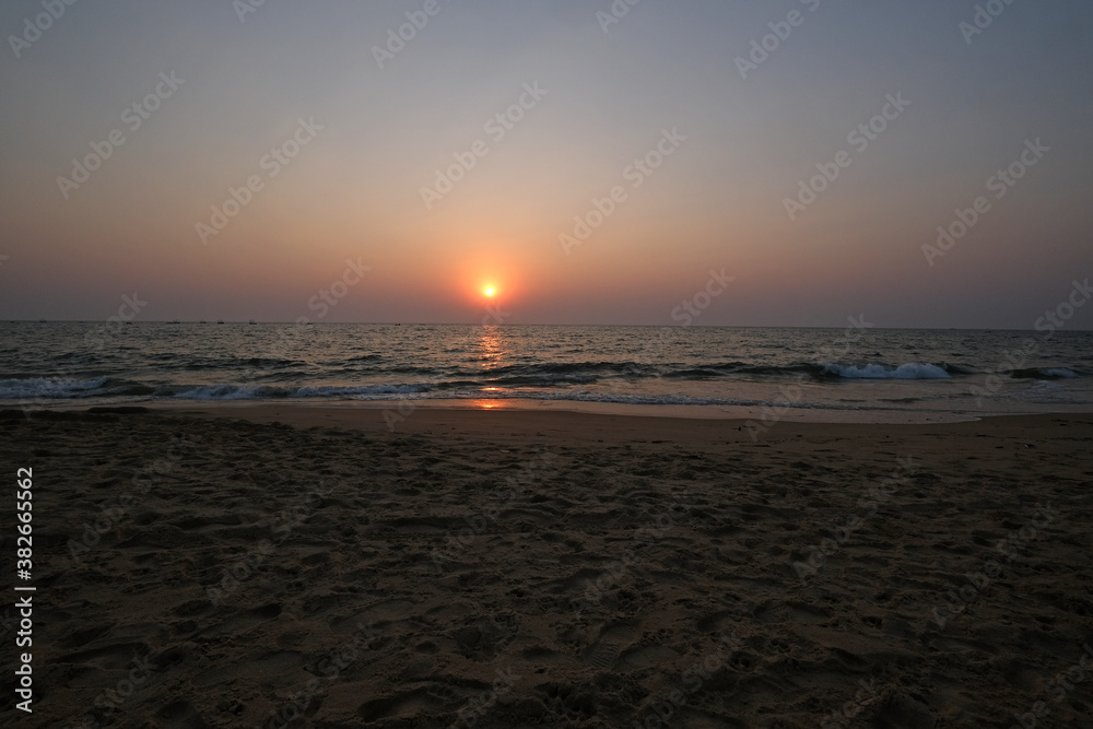 Naklejka premium Sunset at Candolim Beach, North Goa, India