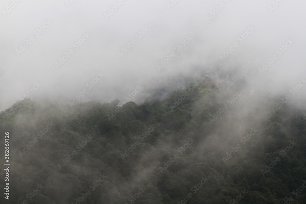 Destination and paradise of the mist and fog in the jungle on the valley mountain. Aerial view of Rainy season in the tropical rainforest in Thailand.