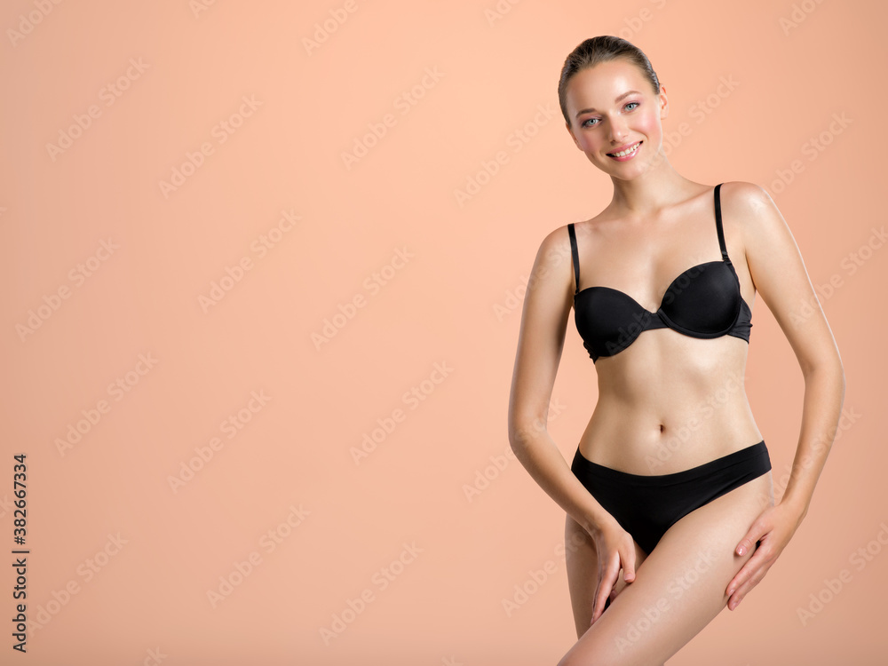 Fototapeta premium Young woman with a beautiful and healthy body. Sexy woman with a perfect body.