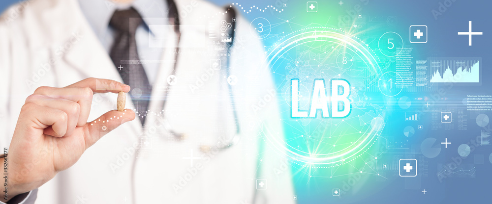 Close-up of a doctor giving you a pill with LAB abbreviation, virology concept Close-up of a doctor giving you a pill with LAB abbreviation, virology concept