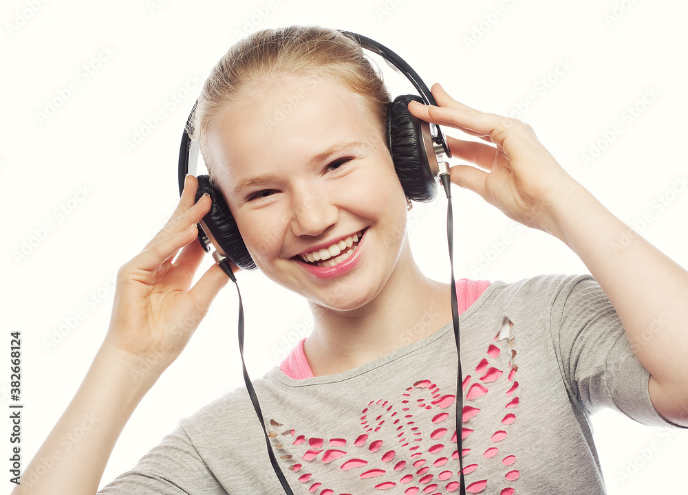 Beautiful happy little girl with headphones Beautiful happy little girl with headphones
