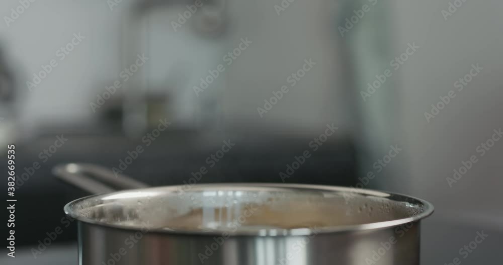 closeup of fusilli boiling in a saucepan closeup of fusilli boiling in a saucepan