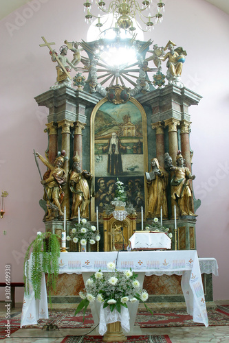 Main altar in the parish church of St. Leopold Mandic in Orehovica, Croatia photo