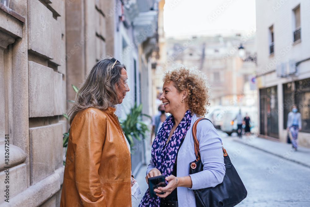 women waiting in the middle of the street