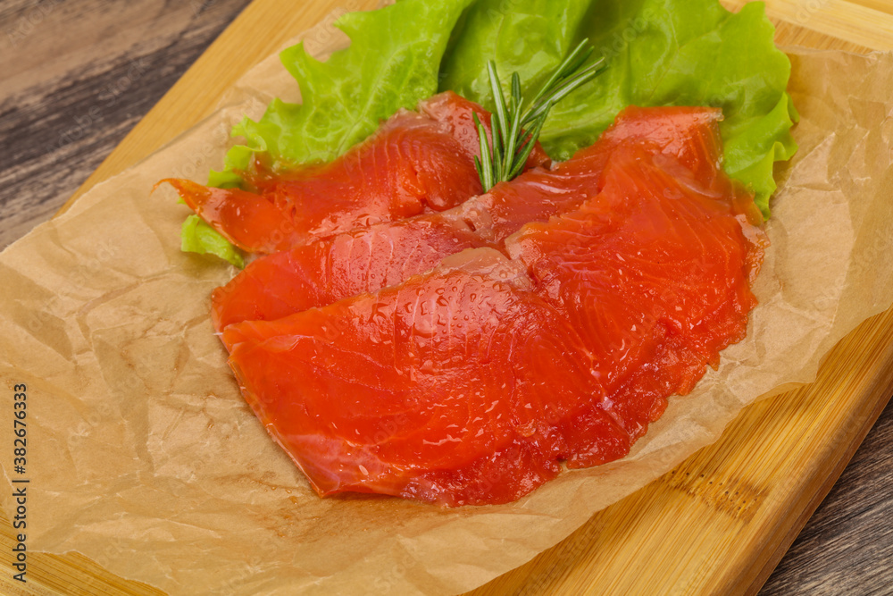 Sliced salmon fillet served rosemary Sliced salmon fillet served rosemary