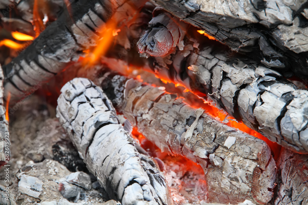 The dying embers of the fire glow beautifully with a red fire. The dying embers of the fire glow beautifully with a red fire.
