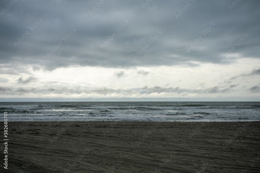 A Dramatic Stormy Sky Over a Dark Beach
