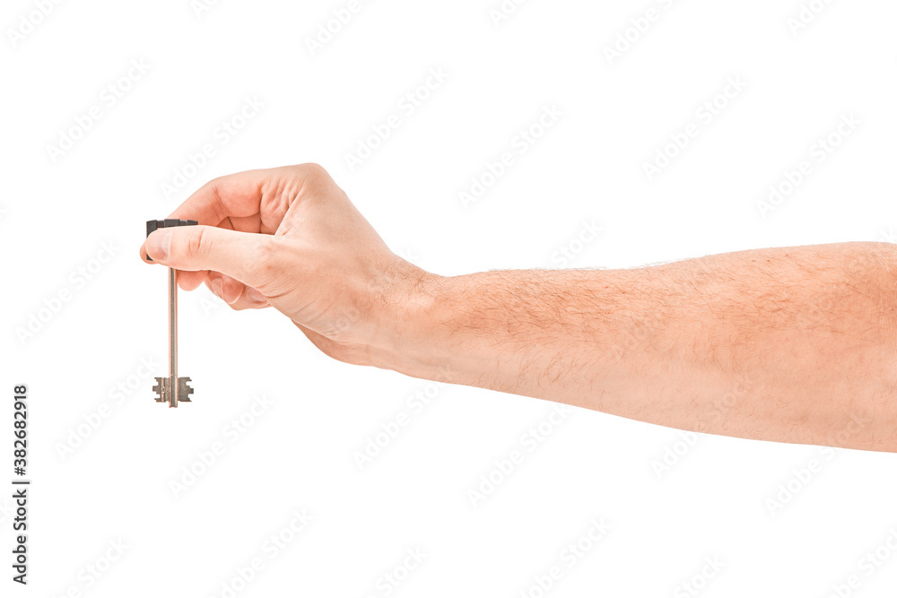 Male hand holding a key to the house, isolated over a white background. Male hand holding a key to the house, isolated over a white background.