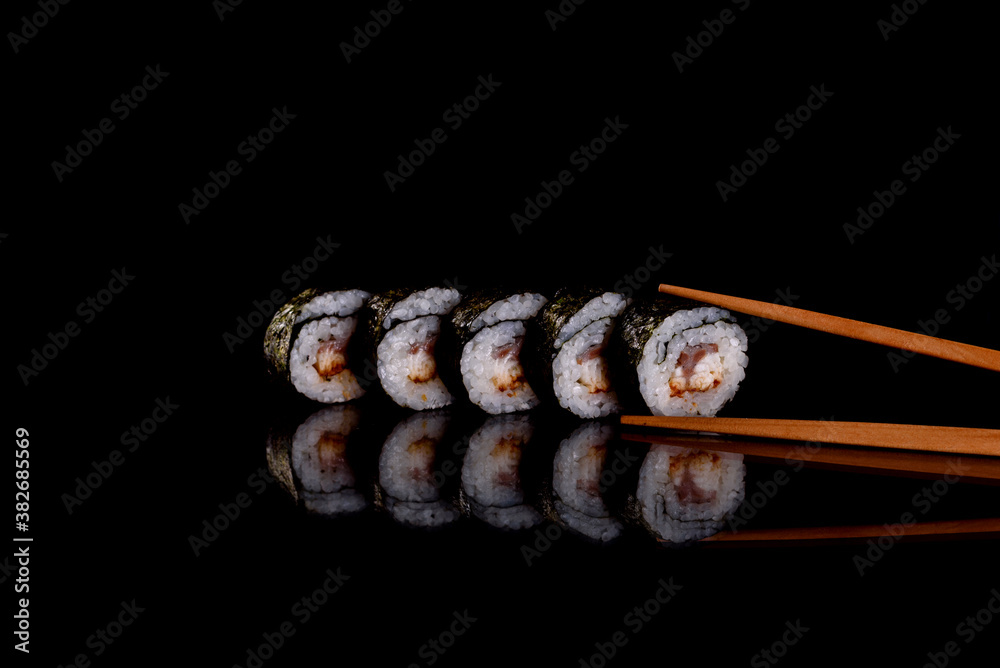 Fresh delicious beautiful sushi rolls on a dark background Fresh delicious beautiful sushi rolls on a dark background