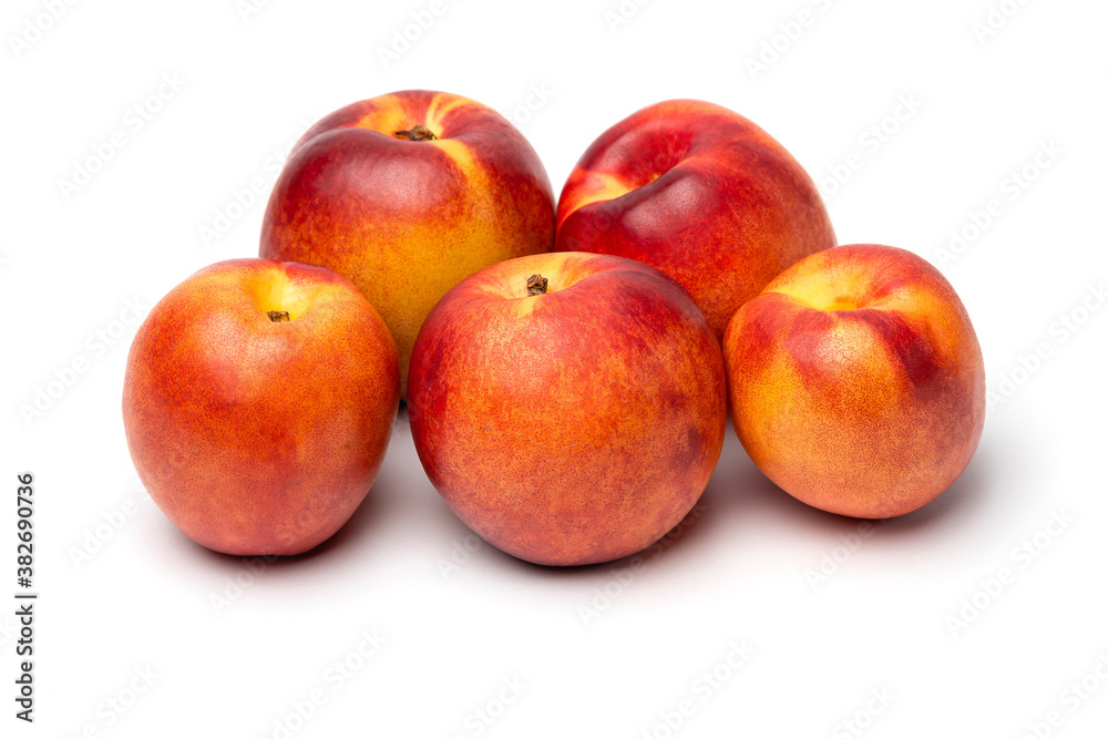 fresh juicy nectarines on a white background