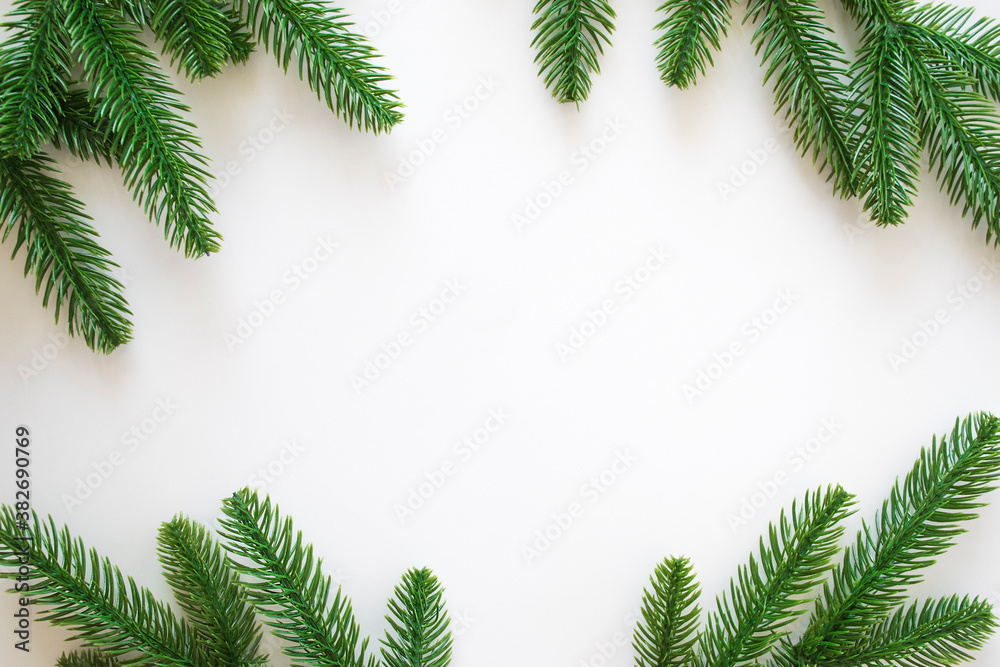 New Year background with green fir branches and pine cones/small red toys/ red snowflakes isolated on white. Winter or Christmas template for your design with copy space. New Year background with green fir branches and pine cones/small red toys/ red snowflakes isolated on white. Winter or Christmas template for your design with copy space.