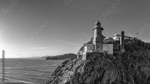 Santa Catalina lighthouse in Lekeitio, drone aerial, black and white, Basque Country