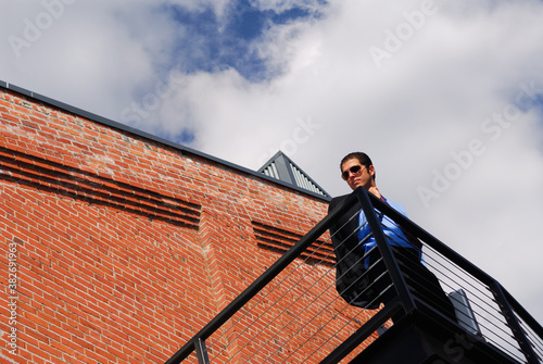 Businessman looking down from a flight of stairs