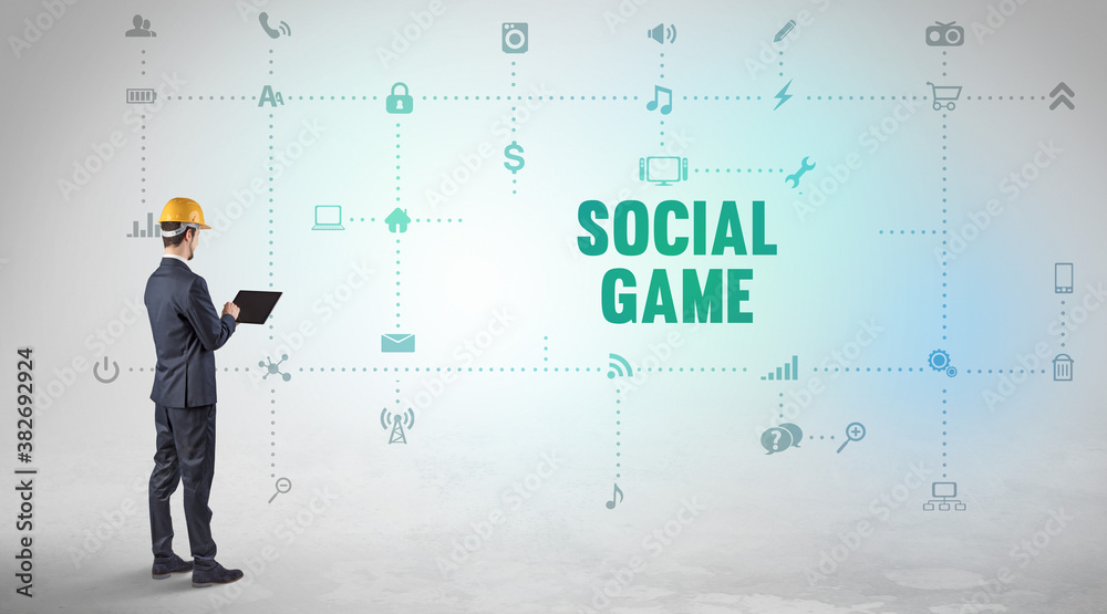 Engineer working on a new social media platform with SOCIAL GAME inscription concept