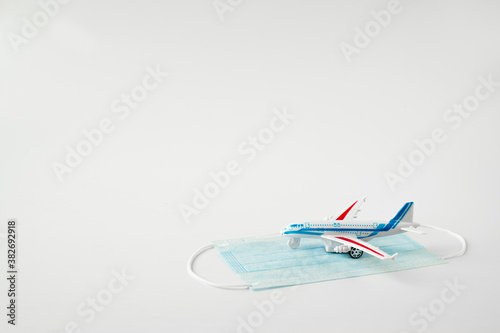 Kirov, Russia - September 12, 2020 Compliance with the mask mode on the plane. Safe flights. Children's toy and mask. photo