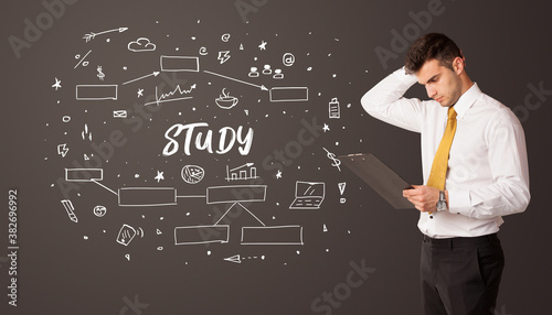 Businessman thinking with STUDY inscription, business education concept