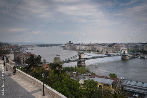 Budapest city landscape with the famous Chain bridge over the Danube river and the Parliament building in the background on a cloudy day, Budapest, Hungary
