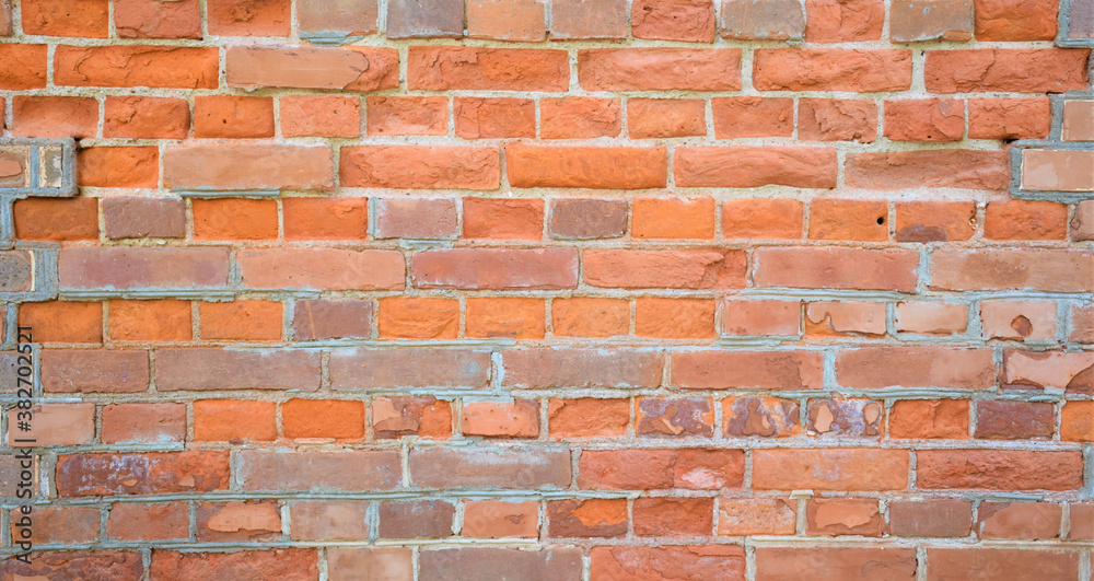bright background, old brick wall, rough texture with red, gray, brown bricks bright background, old brick wall, rough texture with red, gray, brown bricks